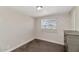 A clean bedroom with carpet flooring, a window, and neutral walls creating a cozy space at 15049 N 25Th Pl, Phoenix, AZ 85032