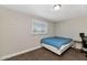 A simple bedroom with a bed, window, and neutral decor create a cozy, comfortable space at 15049 N 25Th Pl, Phoenix, AZ 85032