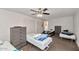 Spacious bedroom with multiple beds, closet, and ceiling fan, great for accommodating guests or Gathering at 15049 N 25Th Pl, Phoenix, AZ 85032