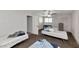 Functional bedroom features ample natural light, with multiple beds, and closet, ideal for comfortable living at 15049 N 25Th Pl, Phoenix, AZ 85032
