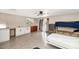 A spacious bedroom with a kitchenette, bunkbeds, and LVP flooring is ready to be customized at 15049 N 25Th Pl, Phoenix, AZ 85032