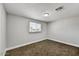 Neutral bedroom features window with blinds and neutral walls and carpeting at 15049 N 25Th Pl, Phoenix, AZ 85032