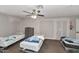 Simple bedroom with multiple beds, ceiling fan, and a functional layout, ready for personalization at 15049 N 25Th Pl, Phoenix, AZ 85032