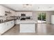 Modern kitchen featuring an island, stainless steel appliances, and crisp white cabinets, great for entertaining at 15049 N 25Th Pl, Phoenix, AZ 85032