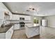 Modern kitchen with stainless steel appliances, stylish white cabinetry, and a convenient kitchen island at 15049 N 25Th Pl, Phoenix, AZ 85032