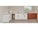 A bright kitchenette features modern cabinetry, countertops, and flooring to complete a fresh look at 15049 N 25Th Pl, Phoenix, AZ 85032