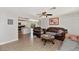 Inviting living room showcases a spacious layout and transitions into an open-concept kitchen area with wood flooring at 15049 N 25Th Pl, Phoenix, AZ 85032