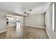 Spacious living room featuring wood flooring and a seamless flow into the bright, modern kitchen at 15049 N 25Th Pl, Phoenix, AZ 85032