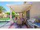Charming back patio with an outdoor dining setup and a built-in grill for summer entertaining at 17710 W Buena Vista Dr, Surprise, AZ 85374