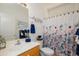 Bathroom with sink and floral shower curtain at 17710 W Buena Vista Dr, Surprise, AZ 85374