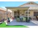 Cozy covered patio with comfortable seating, perfect for outdoor relaxation and entertaining at 17710 W Buena Vista Dr, Surprise, AZ 85374