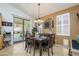 The dining area has a decorative light fixture and sliding glass doors leading to the backyard at 17710 W Buena Vista Dr, Surprise, AZ 85374