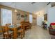 Cozy dining area with natural light, a piano, and comfortable seating, perfect for Gathering gatherings at 17710 W Buena Vista Dr, Surprise, AZ 85374
