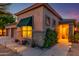 Attractive home exterior with a well-manicured yard, sidewalk lighting, and a three-car garage at 17710 W Buena Vista Dr, Surprise, AZ 85374