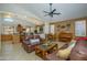 Spacious living area with an open layout, seamlessly connecting the kitchen, dining, and seating areas at 17710 W Buena Vista Dr, Surprise, AZ 85374