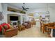 Inviting living room features a fireplace, comfortable leather seating, and an open floor plan at 17710 W Buena Vista Dr, Surprise, AZ 85374