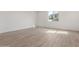 Bedroom features neutral walls and hard wood flooring at 18383 W Monte Lindo Ln, Surprise, AZ 85387