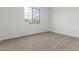 This bedroom offers natural light and a neutral color palette at 18383 W Monte Lindo Ln, Surprise, AZ 85387