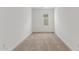 A carpeted bedroom is well lit with a single window at 18383 W Monte Lindo Ln, Surprise, AZ 85387