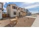 Charming two-story home with desert landscaping, a two-car garage, and a welcoming front facade at 18383 W Monte Lindo Ln, Surprise, AZ 85387