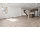Open concept living area with hard wood floors and ample natural light at 18383 W Monte Lindo Ln, Surprise, AZ 85387