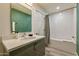 Well-lit bathroom with updated vanity, sink, and shower at 1911 E Claremont St, Phoenix, AZ 85016
