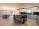 Gourmet kitchen with stainless steel appliances, waterfall island and dining space at 1911 E Claremont St, Phoenix, AZ 85016