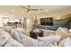 Spacious living room open to the kitchen featuring a custom mural and cozy seating at 1911 E Claremont St, Phoenix, AZ 85016