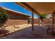 Relaxing covered back patio with desert landscaping and low maintenance yard at 19963 N Window Rock Dr, Surprise, AZ 85374