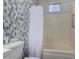 Bathroom featuring modern mosaic tile and a white shower curtain at 19963 N Window Rock Dr, Surprise, AZ 85374