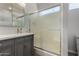 Bathroom with a modern glass shower and a stylish grey vanity cabinet at 19963 N Window Rock Dr, Surprise, AZ 85374