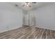 Spacious bedroom featuring modern wood-look flooring and neutral paint at 19963 N Window Rock Dr, Surprise, AZ 85374
