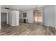 Open dining room features wood-look tile flooring and patio access at 19963 N Window Rock Dr, Surprise, AZ 85374