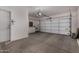 Spacious two car garage with ample storage space and automatic door at 19963 N Window Rock Dr, Surprise, AZ 85374