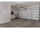 Spacious garage with ample storage space and modern garage door at 19963 N Window Rock Dr, Surprise, AZ 85374