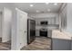 Kitchen with stainless steel appliances, ample cabinets, and wood-look floors at 19963 N Window Rock Dr, Surprise, AZ 85374