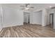 Bright living room with neutral paint and wood-look tile flooring at 19963 N Window Rock Dr, Surprise, AZ 85374