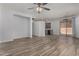 Open living room with wood-look tile flooring and neutral paint at 19963 N Window Rock Dr, Surprise, AZ 85374