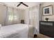Comfortable bedroom featuring a ceiling fan, bright natural light, and a dark dresser at 2231 E Weldon Ave, Phoenix, AZ 85016