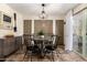 Elegant dining room with a modern table, stylish chairs, and plenty of natural light from the sliding glass door at 2231 E Weldon Ave, Phoenix, AZ 85016