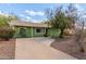 Charming home with green exterior, well maintained landscaping, and a long driveway at 2231 E Weldon Ave, Phoenix, AZ 85016