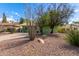 Home featuring an inviting green exterior with mature landscaping and a spacious driveway at 2231 E Weldon Ave, Phoenix, AZ 85016