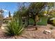 Home exterior featuring mature landscaping and trees in the front yard at 2231 E Weldon Ave, Phoenix, AZ 85016