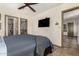Primary bedroom featuring wood-look floors, neutral walls, and a ceiling fan at 2231 E Weldon Ave, Phoenix, AZ 85016