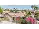 Scenic rooftop view of the neighborhood showcasing mature trees and mountain views in the distance at 2254 E Becker Ln, Phoenix, AZ 85028