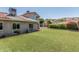 Well-maintained backyard with lush green lawn and colorful landscaping at 2254 E Becker Ln, Phoenix, AZ 85028