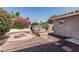 Private backyard with hot tub, built-in firepit, and lush landscaping offers a serene escape at 2254 E Becker Ln, Phoenix, AZ 85028