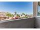 Balcony view featuring beautiful mountain scenery, vibrant flowers, and lush landscaping, creating a serene outdoor space at 2254 E Becker Ln, Phoenix, AZ 85028
