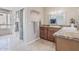 Bright bathroom with a modern vanity, granite countertops, and a glass enclosed shower at 2254 E Becker Ln, Phoenix, AZ 85028
