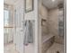 Bathroom with a walk-in shower, bench, and rain shower head at 2254 E Becker Ln, Phoenix, AZ 85028